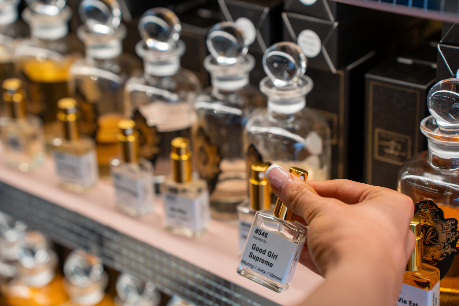 Fragrance layering guide: perfumes Ireland, womens perfumes and mens colognes that last all day in a perfume shop display