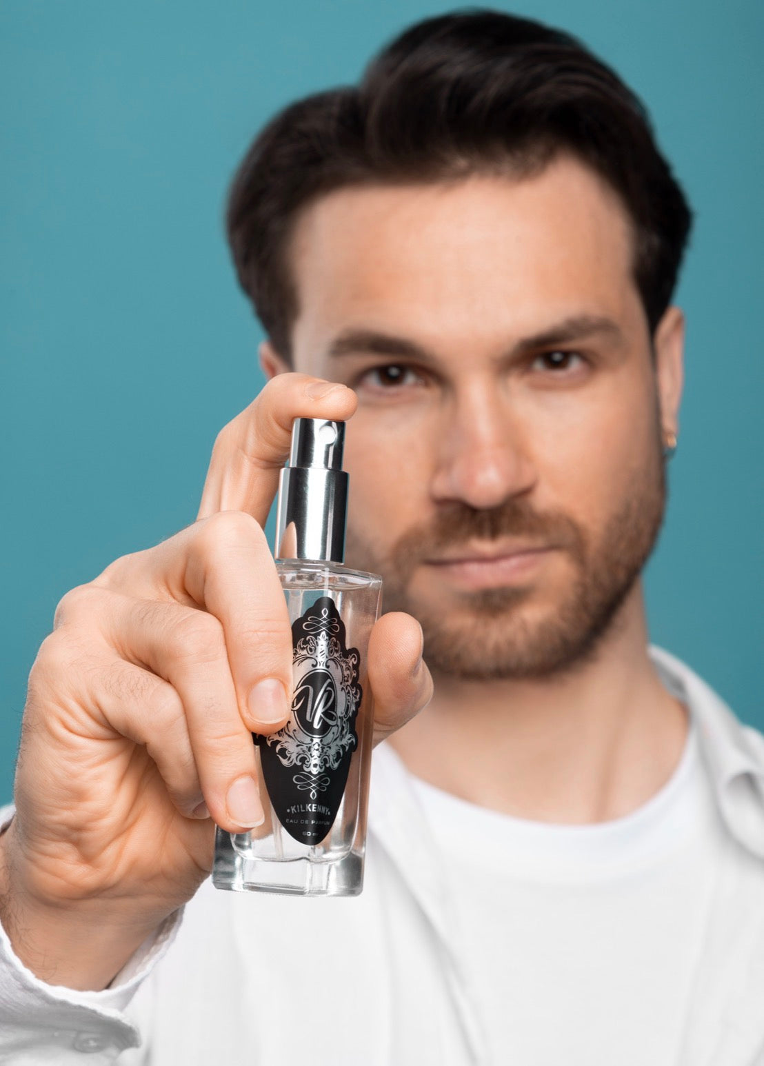 Man holding a Valley of Roses cologne bottle from Kilkenny — best perfume for men in Ireland
