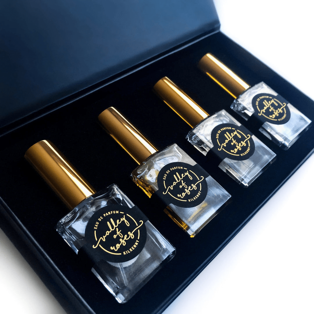 Taurus Astrology Box for Her featuring four elegant perfume bottles with golden caps, perfect for Mother's Day gifts and fragrance lovers.